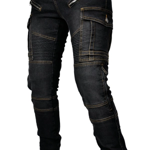 Detail of motorcycle jeans with reinforced pleated knees and orange contrast stitching