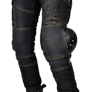 Detail of motorcycle jeans featuring protective knee pads and elastic pleated fabric