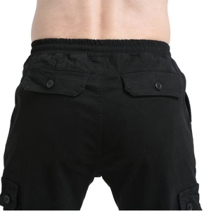 Detail view of motorcycle riding pants showing elastic waistband and large rear pockets