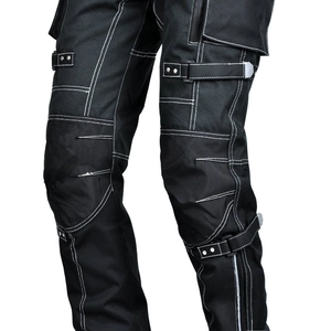 Detail of waterproof motorcycle pants with white contrast stitching and buckle straps