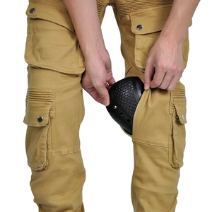 Detail of khaki motorcycle cargo pants featuring knee armor insertion with honeycomb pad