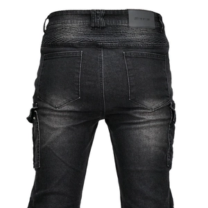 Detail view of motorcycle cargo pants featuring elastic back waist and leather brand patch