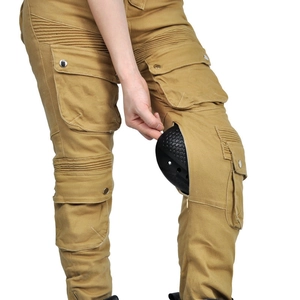 Detail of khaki biker pants showing the removable black knee armor pads and pocket