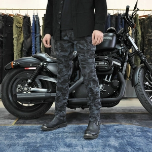 Detail view of grey camo motorcycle pants featuring accordion stretch panels and cargo pockets