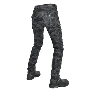 Detail of camouflage motorcycle pants featuring accordion stretch panels and durable cargo pockets