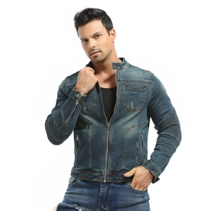 Close-up of blue denim motorcycle jacket showing ribbed pads and chest pockets