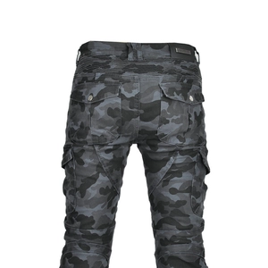 Detail of camouflage motorcycle pants featuring elastic accordion panels for mobility