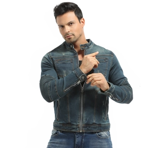 Close-up of retro blue motorcycle denim jacket with zipper pockets and washed finish