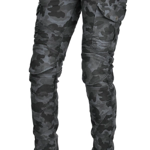 Macro detail of camouflage motorcycle pants featuring elastic knee pleats and cargo pockets