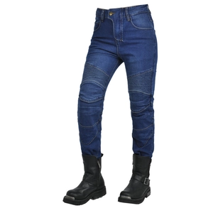 Detail of accordion stretch panels on blue motorcycle jeans with black leather riding boots