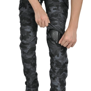 Detail of camouflage motorcycle pants featuring removable honeycomb knee protectors