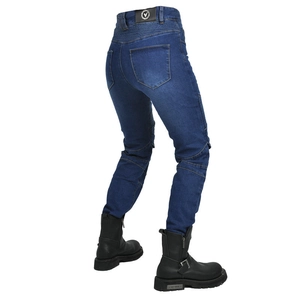 Detail of blue motorcycle jeans with elastic panels and black leather riding boots