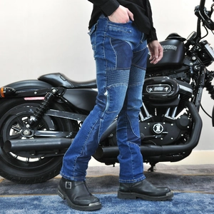 Detail of blue denim motorcycle pants with elastic knee panels for riding comfort