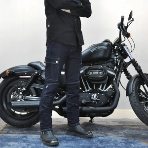 Detail of slim-fit motorcycle jeans with cargo pockets and reinforced knee stitching
