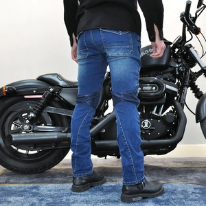 Detail of blue motorcycle denim jeans showing reinforced knee pads and protective fabric