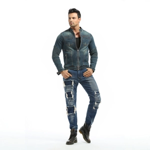 Detail of vintage blue washed denim motorcycle jacket with distressed jeans set