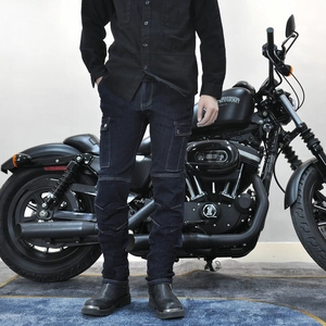 Detail of slim-fit motorcycle jeans with knee protective pleats and side cargo pockets