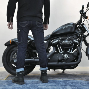 Detailed back view of motorcycle denim cargo pants with pockets and wavy stitching
