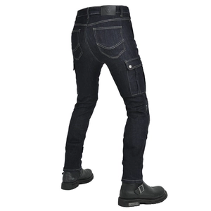 Detail view of deep blue slim-fit motorcycle jeans with cargo pockets and leather patch