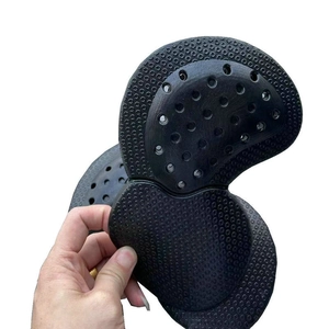 Detail of thickened black motorcycle protective pad with anti-slip texture and vent holes