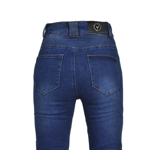 Detail of blue motorcycle jeans featuring elastic back waist and leather brand patch