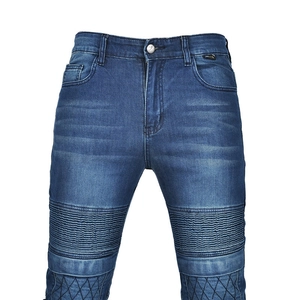 Close-up of motorcycle jeans with ribbed knee panels and diamond quilted stitch details