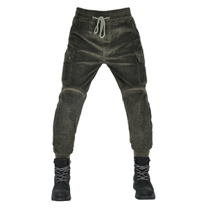 Detail of olive green corduroy motorcycle cargo pants with elastic drawstring waist