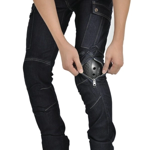 Detail of knee zipper opening with removable honeycomb armor on blue motorcycle jeans