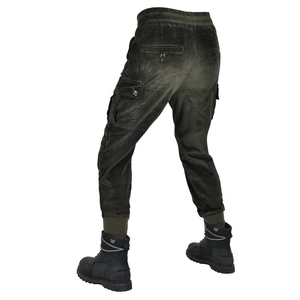 Detailed view of dark green corduroy motorcycle cargo pants with large side pockets