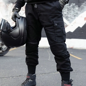 Men's black motorcycle cargo pants with protective knee pleats and cuffed ankles