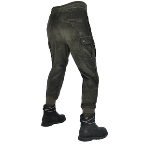 Detail of dark olive corduroy motorcycle pants with side cargo pockets and elastic hem