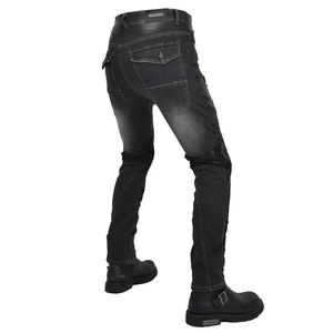 Detail of motorcycle denim pants featuring accordion stretch panels at knees for protection