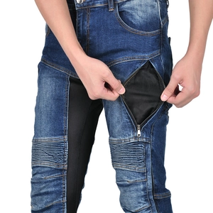Detail of mesh ventilation panel and zip pocket on blue denim motorcycle pants