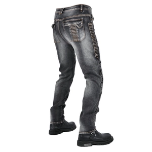 Detail of grey motorcycle denim jeans featuring reinforced accordion stretch panels at knees