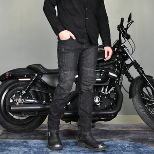 Close-up of motorcycle riding jeans with accordion panels and a side zipper pocket