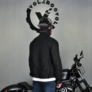 Back view of a retro waxed coating motorcycle jacket with a slim fit and adjustable hem