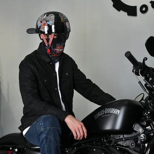 Close-up of motorcycle half helmet with eagle flag print and riding face mask