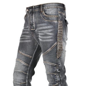 Detail of grey biker jeans with elastic accordion ribbing and reinforced stitching