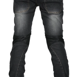 Detail of motorcycle jeans showing breathable mesh panels and reinforced stitching