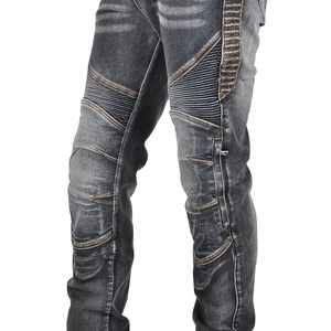 Detailed view of knee pleats and metallic zipper on motorcycle denim riding jeans