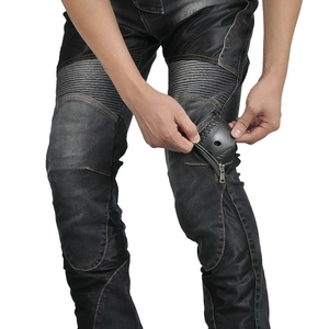 Detail showing the removable knee protector on motorcycle denim riding pants with stitching