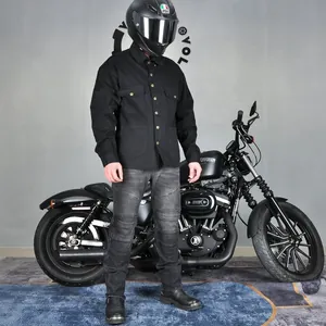 Detail of windproof motorcycle riding shirt and vintage denim pants with knee padding