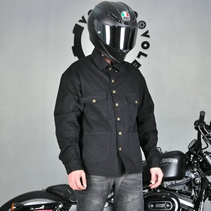 Close-up of retro black protective motorcycle riding shirt with four utility pockets
