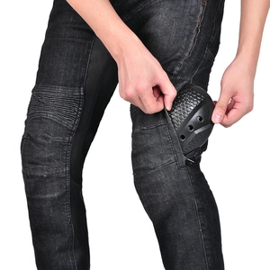 Detail of motorcycle jeans with side zipper pocket showing knee armor installation
