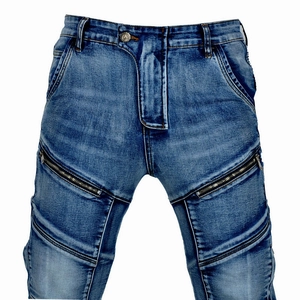 Detail of motorcycle jeans with reinforced stitching and decorative zippers on thighs