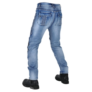 Detail of light blue washed motorcycle jeans with elastic accordion panels on knees