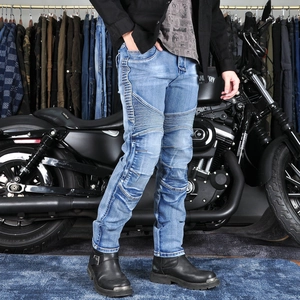 Detail of blue motorcycle jeans featuring accordion stretch panels on the knees for riding