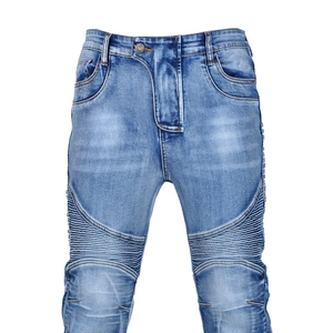 Detail view of motorcycle jeans featuring ribbed biker-style thigh panels and washed blue denim