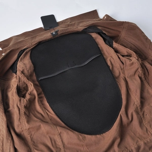 Detail of internal mesh pocket for back protector in waxed canvas motorcycle jacket