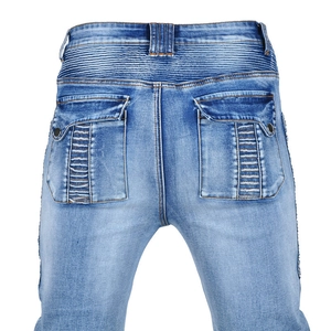 Detailed back view of vintage blue motorcycle jeans with ribbed knee panels and flap pockets